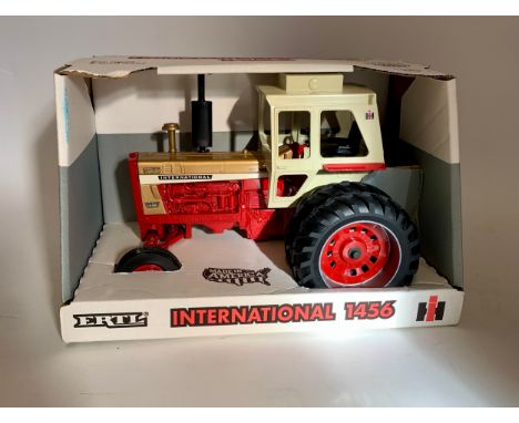 4 die cast collectors tractors.Farmall Cub tractor, 1/16 scale.International Cub tractor, 1/16 scale.ERTL 50th anniversary si