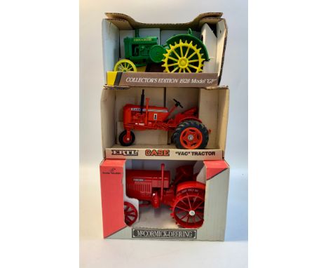Five Die cast tractors.John Deere 1953 model BR, 1 :16 scale.Ferguson TO-20, 1:16 scale.John Deere 1928 model GP, 1:16 scale.