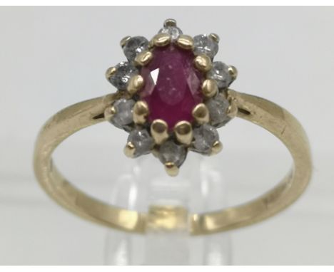 9ct Gold ruby and diamond oval cluster ringHallmarked 9ct yellow gold, Sheffield 2000, L ASize - N/O , Weight -2.02g