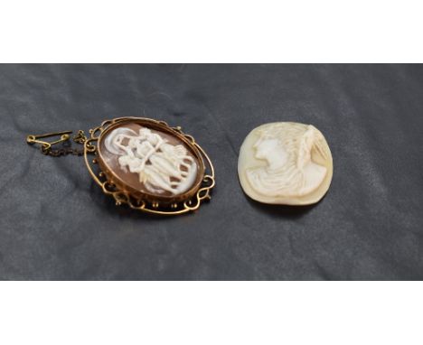 A conch shell cameo brooch depicting the three graces in an open decorative yellow metal brooch stamped 9ct, cameo panel AF, 