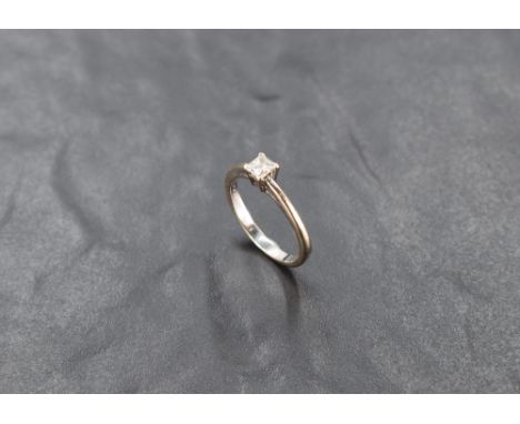 A princess cut diamond solitaire ring, approx 0.33ct in a 4 claw mount on an 18ct white gold loop, size n &amp; approx 3.2g