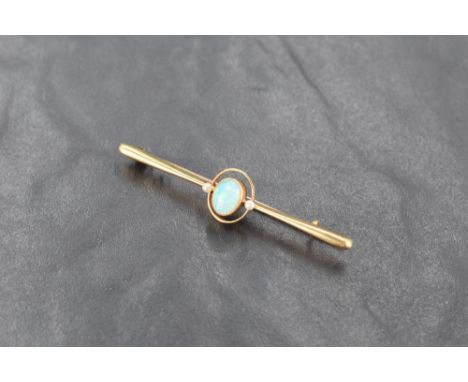 A 15ct gold opal and seed pearl bar brooch, the central oval opal cabochon enclosed within a seed pearl set oval surround and