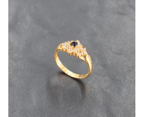 A sapphire and clear stone cluster ring with set cut shoulders on a 22ct gold loop, size M &amp; 3.5g