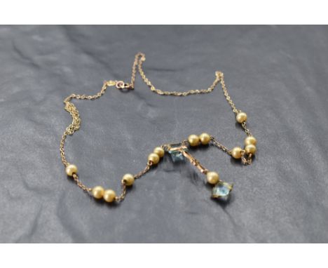 A yellow metal necklace bearing plaque stamped 9ct having blue paste and simulated pearl decoration, approx 16' &amp; 3.5g