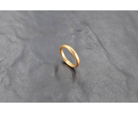 A 22ct gold wedding band, ring size L, 5.3grams