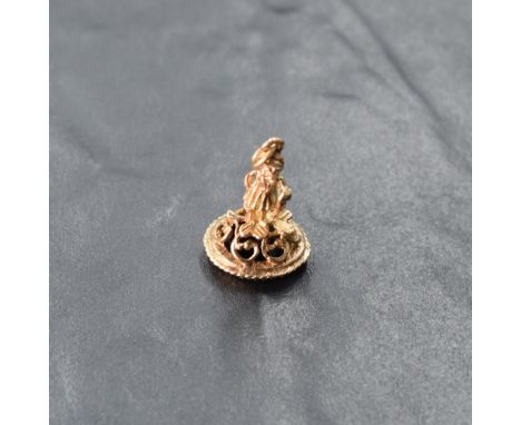 A 9ct rose gold fob modelled as an elf with jet panel to base, approx 3.6g