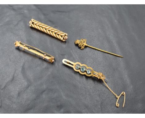 Three yellow metal/9ct gold bar brooches and a stick pin, of various forms, approx 10.5g