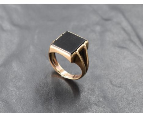 A 9ct gold signet ring having onyx panel with moulded shoulders, size P &amp; 6g