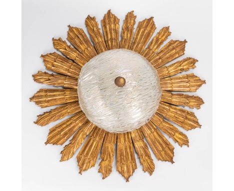 A ceiling lamp in the shape of the sun, made of sculptured wood and glass. The second half of the 20th century. (17 x 63 cm)