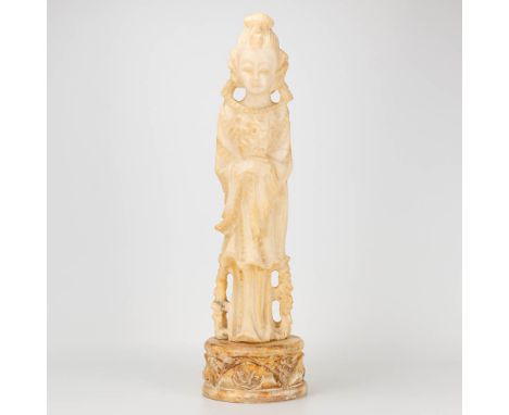 A statue of a Chinese figurine made of sculptured alabaster. Originally a lamp base. (59 x 15 cm)