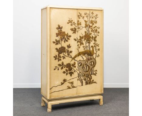 A wardrobe made in Oriental style and decorated with a hand-painted bird and trees. The first half of the 20th century. (40 x