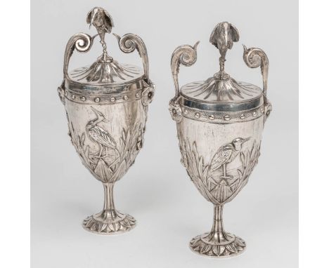 A pair of silver plated vases with lid and decorated with birds and owls. The first half of the 20th century. (9 x 11 x 24 cm