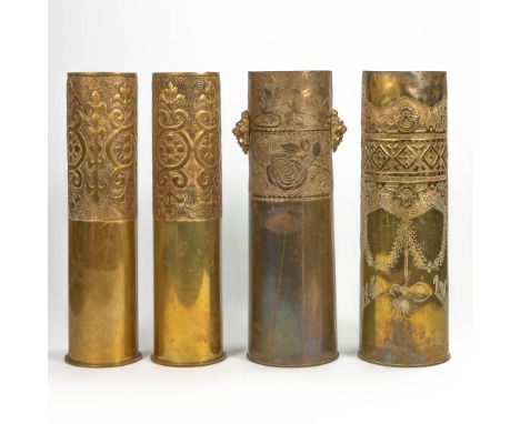 A collection of 4 cannon shells 'Trench art' decorated with copper engravings. First half of 20th century during World War 1.