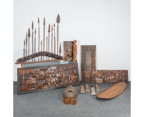 An assembled collection of 26 pieces of African art. (4,5 x 152 x 56 cm)