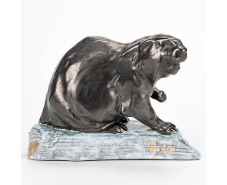 Josu‘ DUPON (1864-1935) a ceramic statue of an otter on ice. Condition: glaze with missing parst and restorations. (11 x 21 x