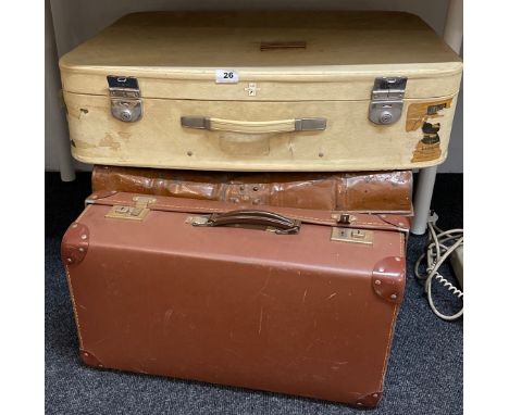A tin trunk and two items of vintage luggage.