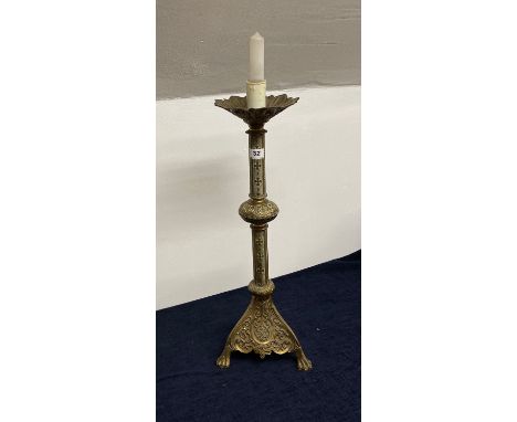 A 19th century gothic style brass candlestick converted as a table lamp, H. 65cm.