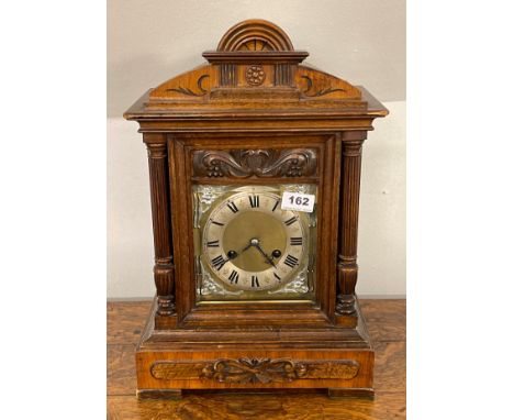 A 19th century oak and mahogany veneered bracket clock, H. 44cm.