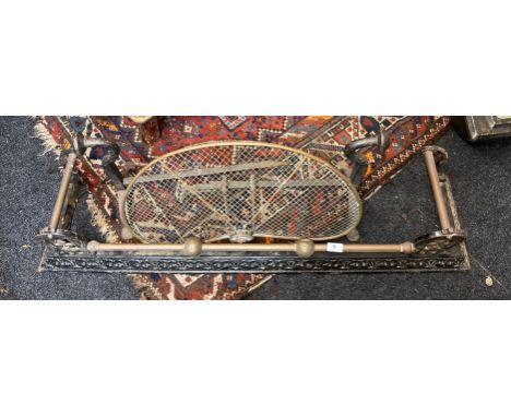 A 19th century cast iron and brass fender, W. 109cm, D. 29cm. Together with a hook over brass fan screen and a pair of copper