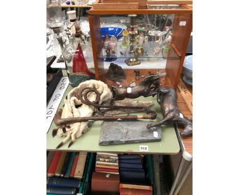 A DISPLAY CASE CONTAINING BESWICK BEATRIX POTTER FIGURES ETC. A SHIPIN BOTTLE LAMP, A WHIP, TWO HORSE FIGURES A FUR STOLE ETC