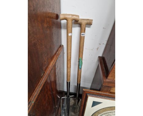 A STAINLESS STEEL GARDEN FORK AND SPADE