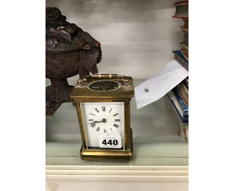 A VINTAGE BRASS CASED CARRIAGE CLOCK.