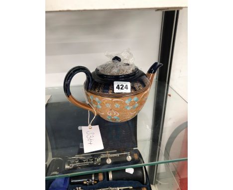 A DOULTON TEA POT AND A MODERN CARRIAGE CLOCK.