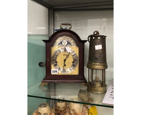 A MINERS LAMP TOGETHER WITH A GERMAN HERMLE THREE TRAIN MANTEL CLOCK CHIMING ON RODS
