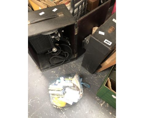 A VINTAGE8MM HOME KODACOLOUR 8 PROJECTOR AND FOURTEEN 8MM SPOOLS OF OLD TIME MOVIES AND A A BOX OF RECORDS.