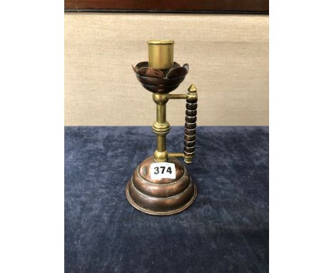 AN ARTS AND CRAFTS CANDLESTICK IN THE MANNER OF WAS BENSON.