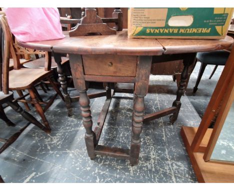 A GEORGIAN OAK COTTAGE GATE LEGGED TABLE 