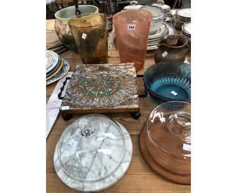 TWO GLASS CHEESE DISH COVERS, GLASS VASES AND A BOWL, A WROUGHT IRON MOUNTED TILE STAND AND A POTTERY ICED LEMONADE JUG
