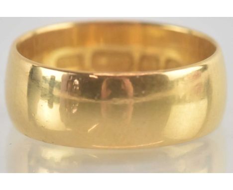 A 22ct gold wide wedding ring, size J, approx 4.9g.