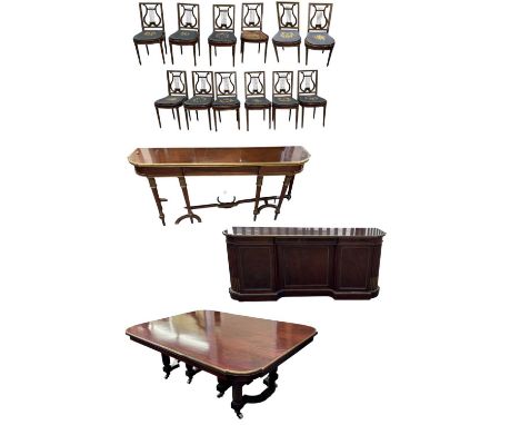 An early 19th century French Napoleon III dining suite, with large mahogany and brass bound dining table, with bronze mounted