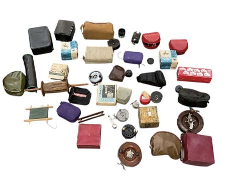 A collection of approximately twenty assorted modern fishing reels, including Mitchell, K. P. Morritt Intrepid fishing reels 