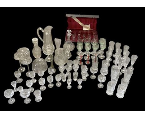 A quantity of assorted cut and crystal glassware, including a cased set of eleven early 20th century gilt decorated etched be