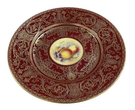ROYAL WORCESTER; a modern display plate, with a central hand painted circular panel depicting fruit, with a classical gilt em
