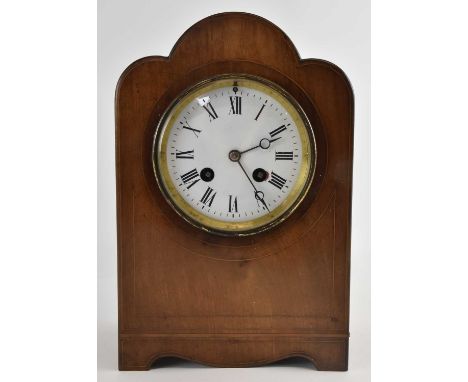 An Edwardian mahogany and crossbanded mantel clock, the white enamel dial set with Roman numerals and subsidiary seconds, hei