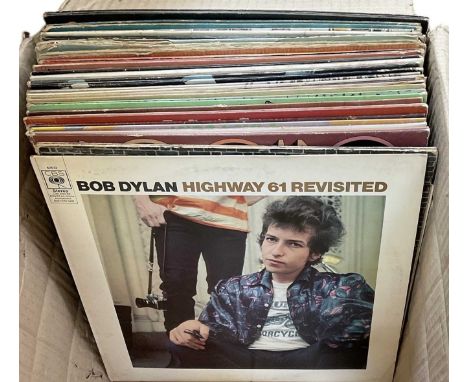 A collection of approximately twenty-five American rock and pop records, including Bob Dylan, Neil Young, Derek and the Domin