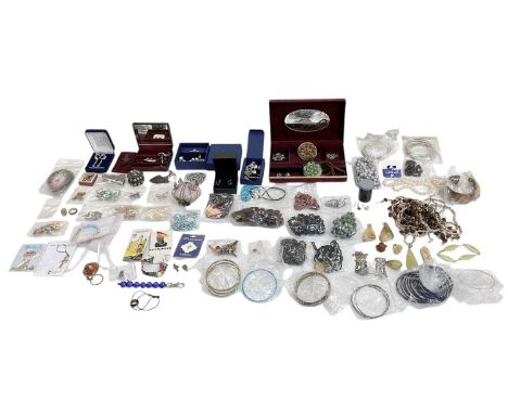 A large quantity of assorted costume jewellery including Swarovski, enamelled brooches, beads, bangles, necklaces, rings, etc