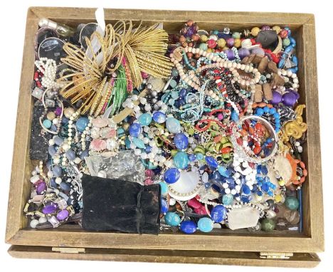 A large quantity of assorted costume jewellery including beads, bangles, necklaces, brooches, bracelets, sunglasses, etc.