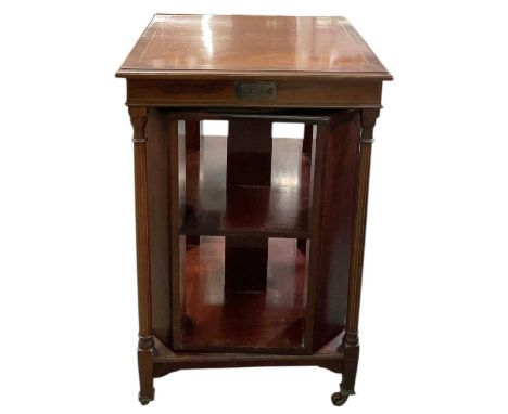 An Edwardian mahogany and satinwood crossbanded revolving bookcase, with silver plaque inscribed 'Presented to Dr Stoddart by
