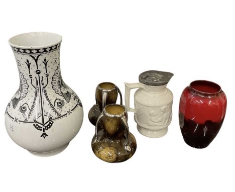 ROYAL DOULTON; a flambé glazed vase, decorated with a cottage amongst rural landscape, height 17cm, a further early 20th cent