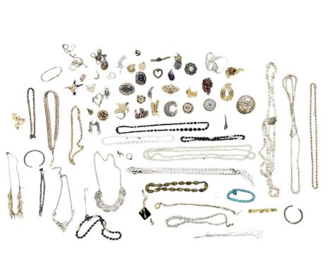 A collection of modern and vintage costume jewellery including tie clips, necklaces, brooches, earrings, rings, etc.
