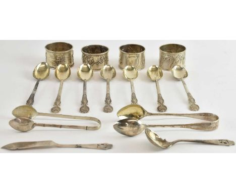 A set of seven Chinese Export silver teaspoons, all length 14cm, a set of three Chinese white metal napkin rings, a further C