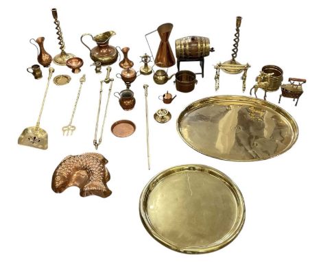 A quantity of assorted metalware including brass three piece companion set, two large brass trays, copper jugs, wooden brass 