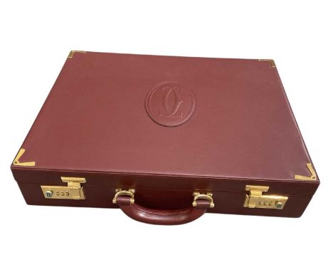 MUST DE CARTIER; a gentleman's red leather gilt metal mounted briefcase, with fitted interior, with Must de Cartier card numb