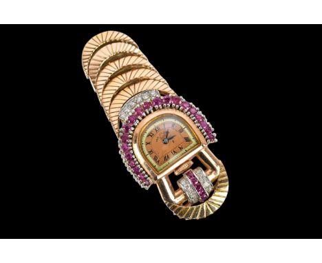 An Art Deco style yellow metal ruby and diamond set pendant watch, the dial set with Roman numerals, signed Paul Ditisheim So