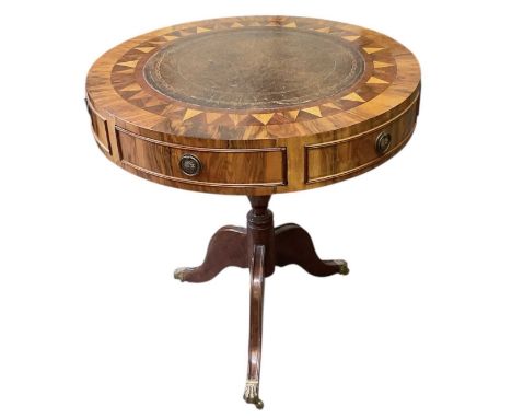 An early 19th century walnut and parquetry inlaid gilt tooled brown leather top drum type circular tripod side table, diamete