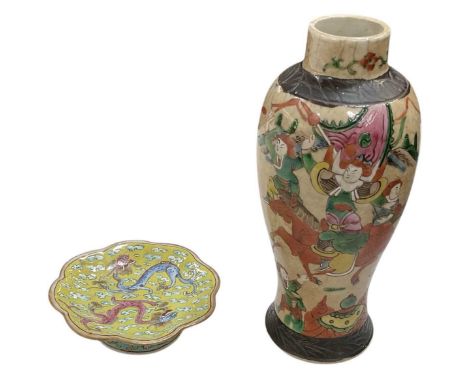 An early 20th century Chinese crackle glazed baluster form vase, decorated with cavorting figures on horseback, height 25.5cm